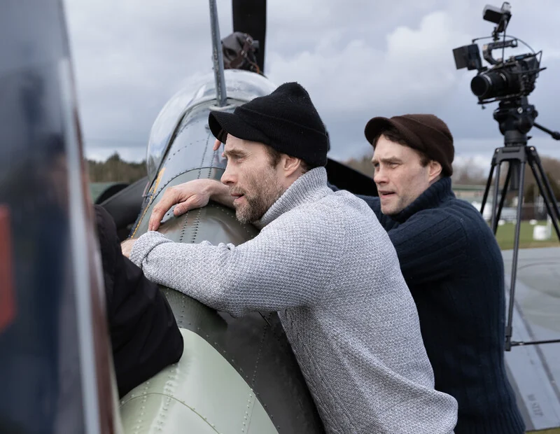Ian and Dominic Higgins beside a Spitfire